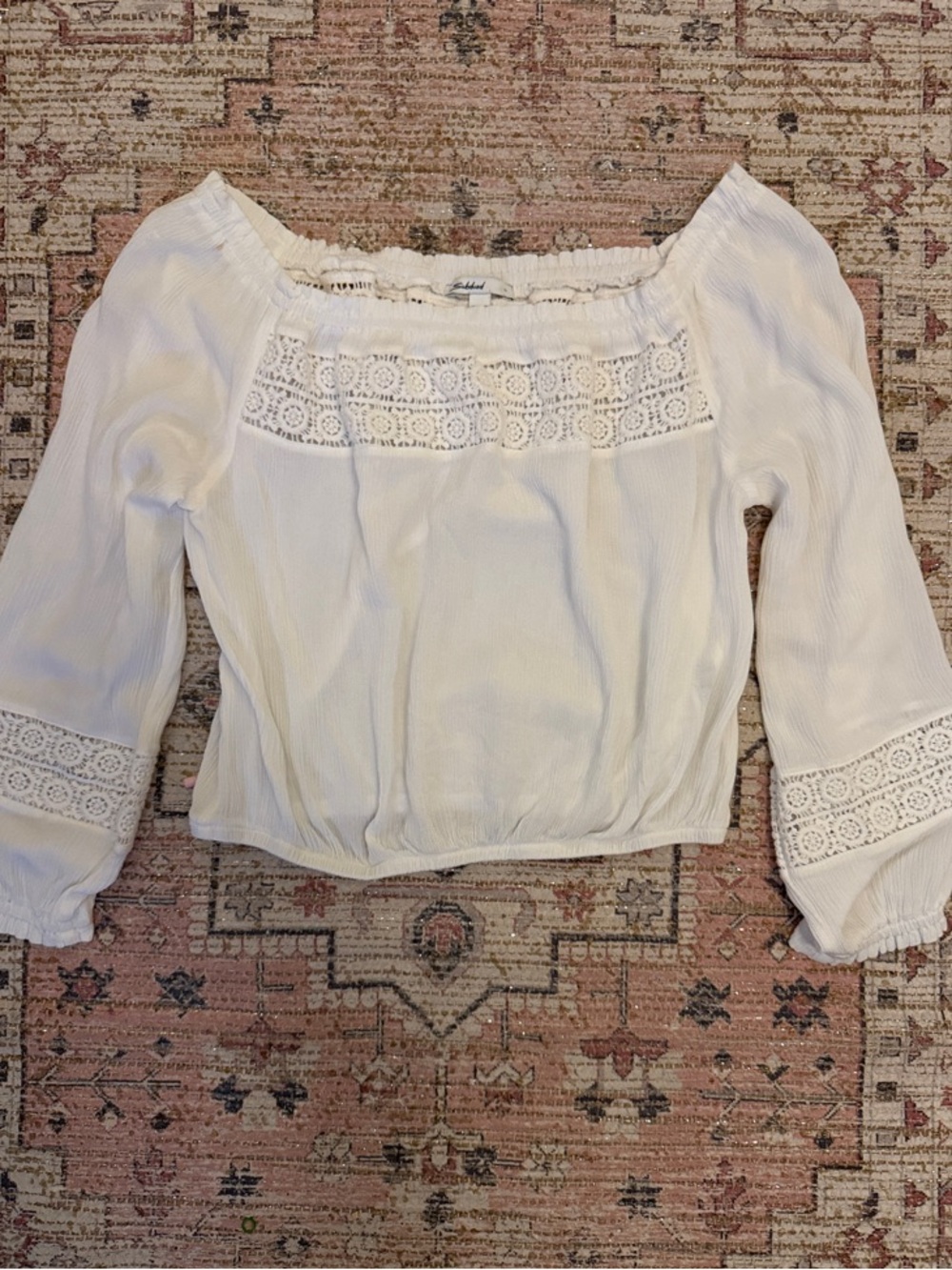 Subdued Off-the-Shoulder White Top with lace trim